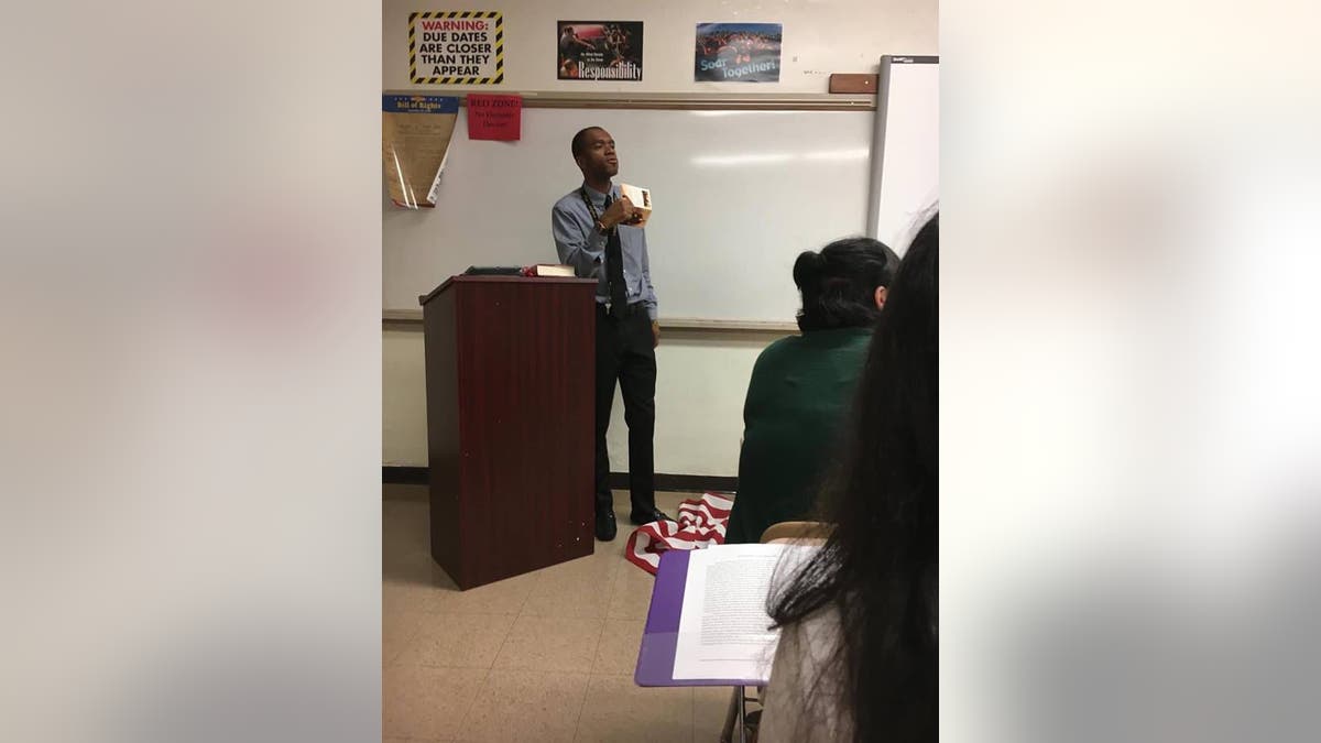 teacher stomps on flag