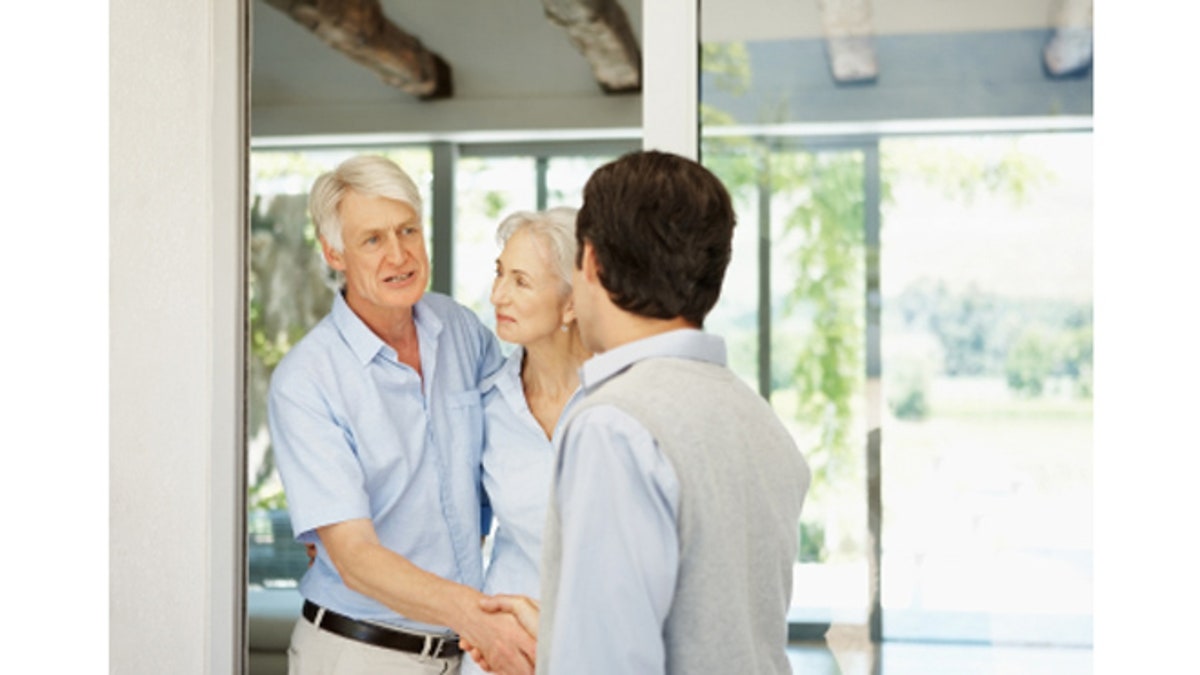 Visitor - Couple greeting a man at their door
