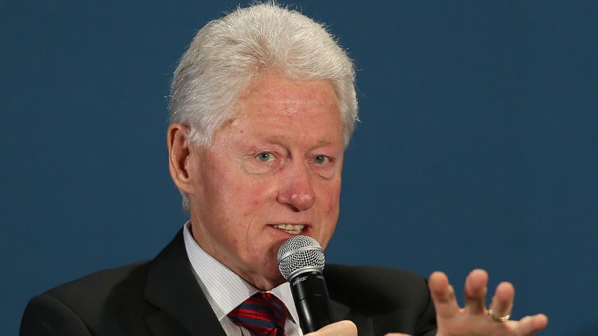 CORAL GABLES, FL - DECEMBER 11:  Former President Bill Clinton speaks during the  Clinton Foundations Future of the Americas summit at the University of Miami  on December 11, 2014 in Coral Gables, Florida. The summit is bringing together leaders from the private, public, and civic sectors across Latin America, the Caribbean, Canada, and the United States to work on economic prosperity, investment, and innovation opportunities across the Western Hemisphere.  (Photo by Joe Raedle/Getty Images)