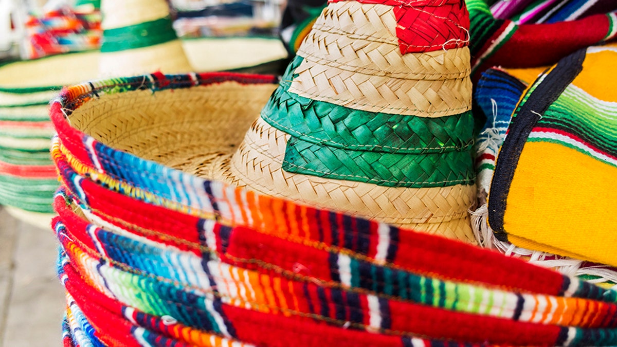 Stacked Mexican sombreros at a street market