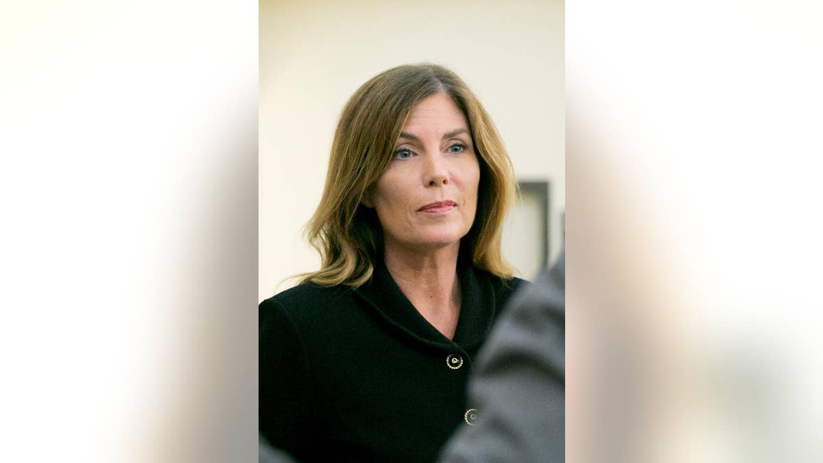 Pennsylvania Attorney General Kathleen Kane leaves the courtroom after closing arguments in her perjury and obstruction trial at the Montgomery County Courthouse, Monday, Aug. 15, 2016, in Norristown, Pa., (Jessica Griffin/The Philadelphia Inquirer via AP, Pool)