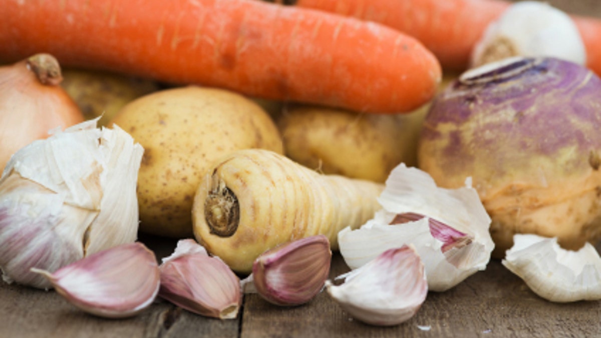 Winter seasonal vegetables collection including potatoes, parsnips, swede and carrots