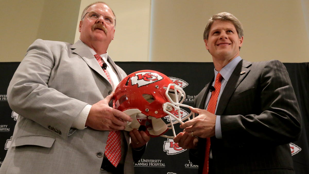 New Kansas City Chiefs NFL team head football coach Andy Reid, left, and owner Clark Hunt pose for photographers during a news conference at Arrowhead Stadium Monday, Jan. 7, 2013, in Kansas City, Mo. (AP Photo/Charlie Riedel)