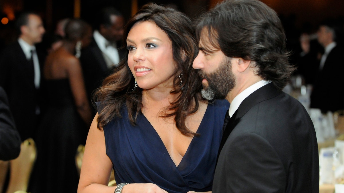 TV food personality Rachael Ray and her husband John Cusimano attend the White House Correspondents' Association Dinner in Washington, May 1, 2010.