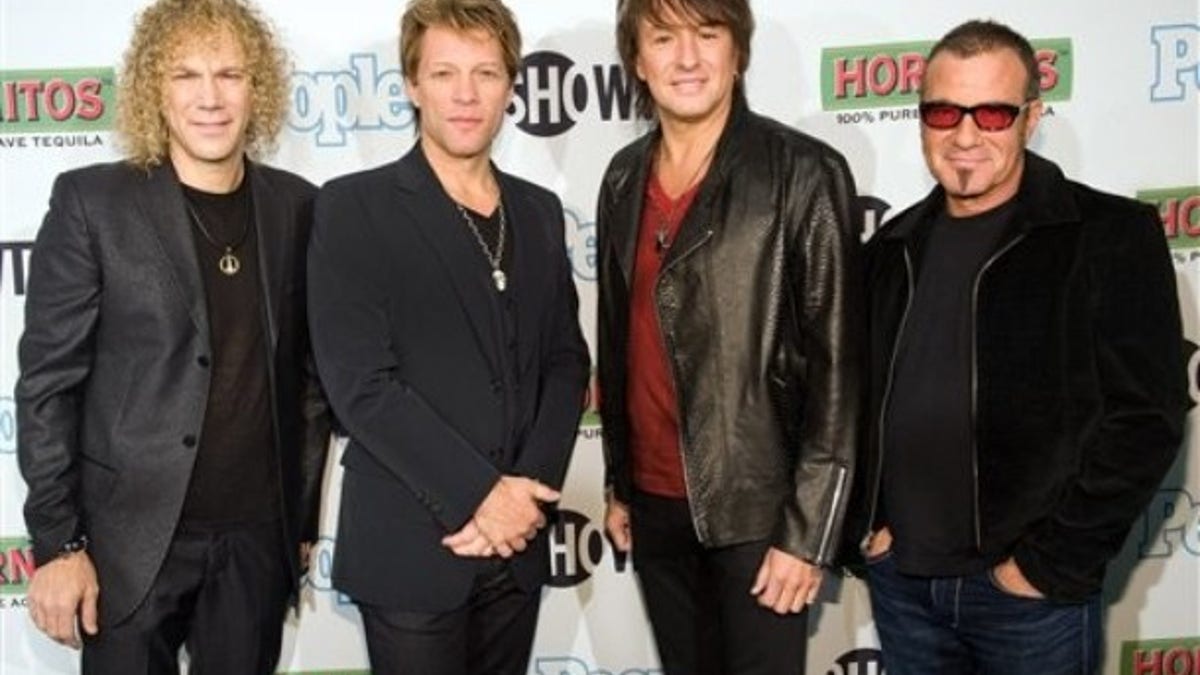Bon Jovi band members David Bryan, Jon Bon Jovi, Richie Sambora and Tico Torres attend the premiere of Showtime's "Bon Jovi: When We Were Beautiful" documentary in New York, Wednesday, October 21, 2009. (AP Photo/Charles Sykes)