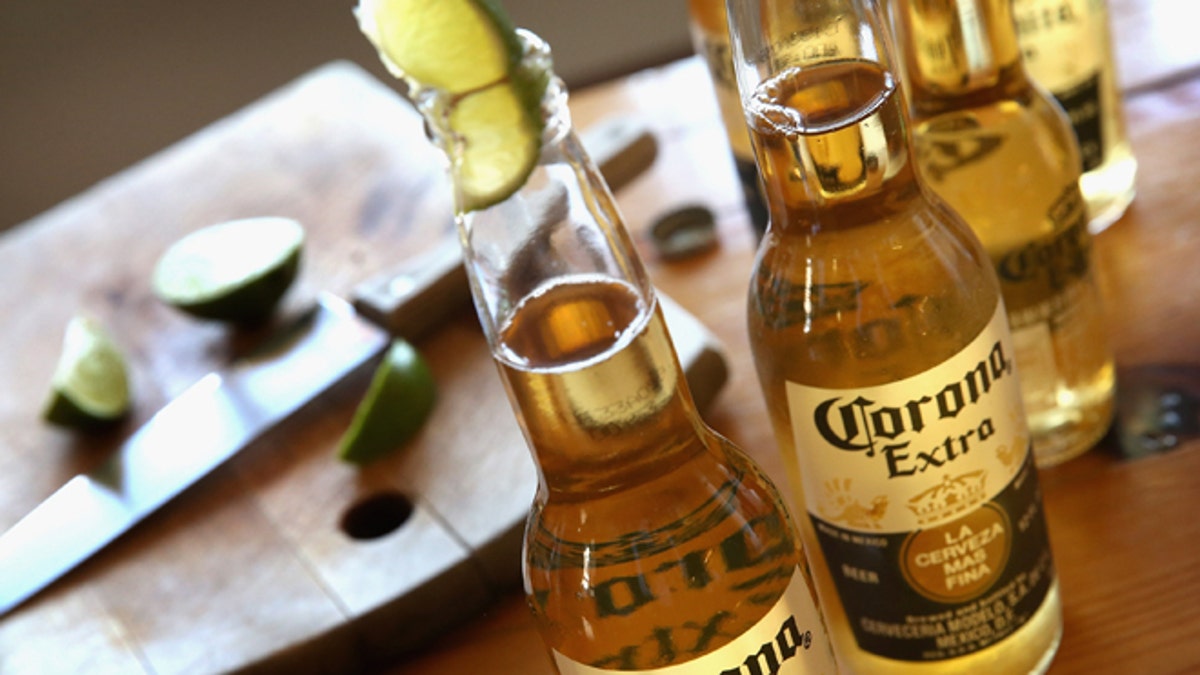 CHICAGO, IL - JUNE 07:  In this photo illustration, bottles of Corona beer are shown on June 7, 2013 in Chicago, Illinois.  Constellation Brands, one of the world's largest wine companies, is expected to become the third-largest beer supplier in the United State today with a $5.3 billion purchase of the U.S. distribution rights of Grupo Modelo beers from Anheuser Busch InBev. Corona Extra, brewed by Grupo Modelo, is the number one selling imported beer sold in the United States and the number six selling beer overall.  (Photo Illustration by Scott Olson/Getty Images)