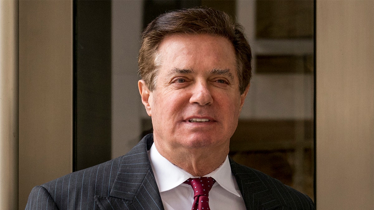FILE - In this April 4, 2018, file photo, Paul Manafort, President Donald Trump's former campaign chairman, leaves the federal courthouse in Washington.  Manafort is appealing a judgeâs decision to jail him while he awaits trial on several felony charges. Attorneys for Paul Manafort filed a notice of appeal Monday saying they want a federal appeals court to review the order by U.S. District Judge Amy Berman Jackson. They also are appealing Jacksonâs order dismissing a civil suit Manafort brought challenging special counsel Robert Muellerâs authority to prosecute him.  (AP Photo/Andrew Harnik, File)