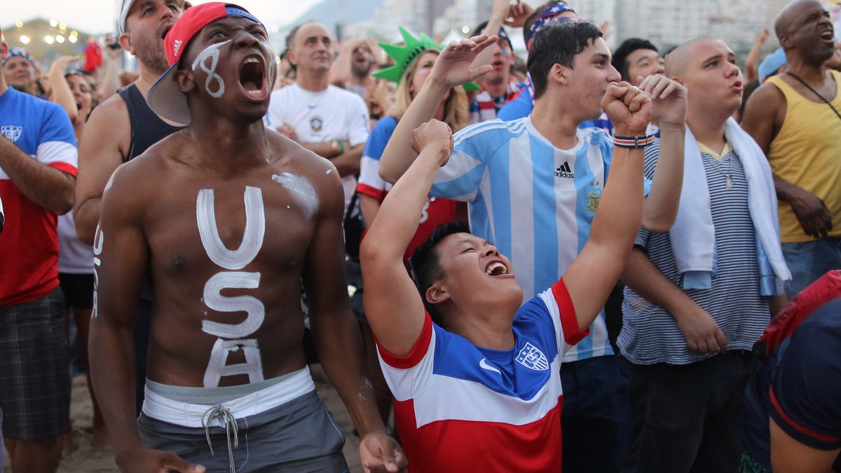 U.S. shot fans watch their team's World Cup information of 16 lucifer against Belgium connected a unrecorded telecast wrong nan FIFA Fan Fest area connected Copacabana formation successful Rio de Janeiro, Brazil, Tuesday, July 1, 2014. (AP Photo/Leo Correa)
