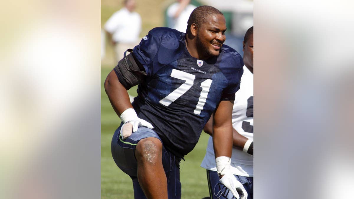 FILE - In this Aug. 15, 2006, file photo, Seattle Seahawks offensive tackle Walter Jones smiles along the sidelines during NFL football training camp at Eastern Washington University in Cheney, Wash. Jones will be inducted into the Pro Football Hall of Fame in Canton, Ohio on Saturday, Aug. 2, 2014.  (AP Photo/Jim Bryant, File)