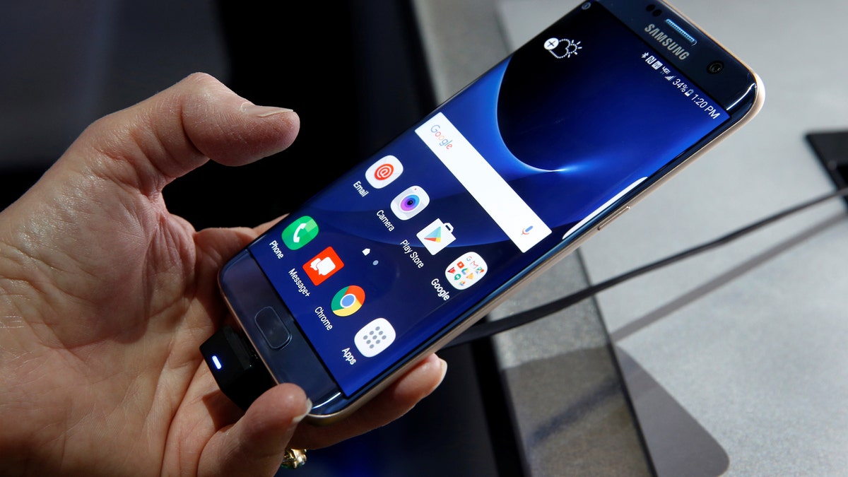 A Samsung S7 Edge Blue Coral smartphone is displayed during the 2017 CES in Las Vegas, Nevada January 5, 2017. REUTERS/Steve Marcus - RTX2XPCY