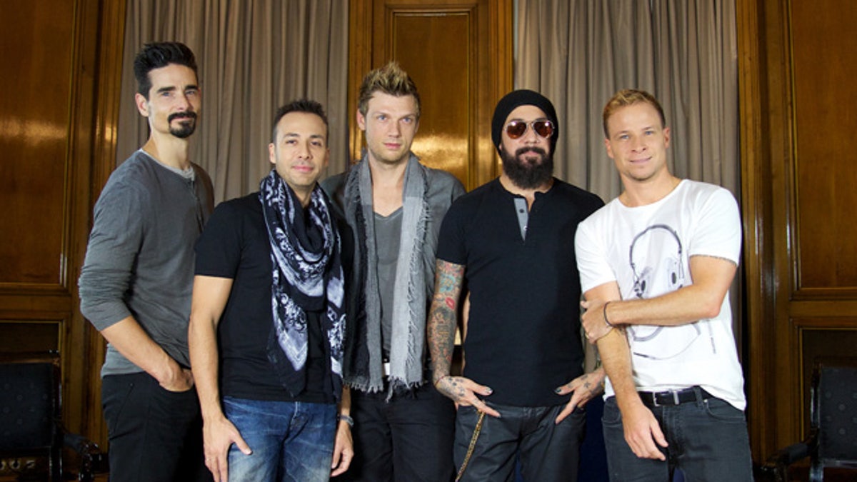 The five members of the Backstreet Boys stand together for a photo