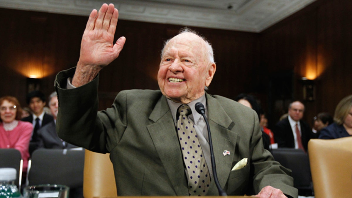 FILE - In this Wednesday, March 2, 2011, file photo, entertainer Mickey Rooney waves on Capitol Hill in Washington, prior to testifying about elder abuse, before the Senate Aging Committee. Rooney, a Hollywood legend whose career spanned more than 80 years, has died. He was 93. Los Angeles Police Commander Andrew Smith said that Rooney was with his family when he died Sunday, April 6, 2014, at his North Hollywood home. (AP Photo/Alex Brandon, File)