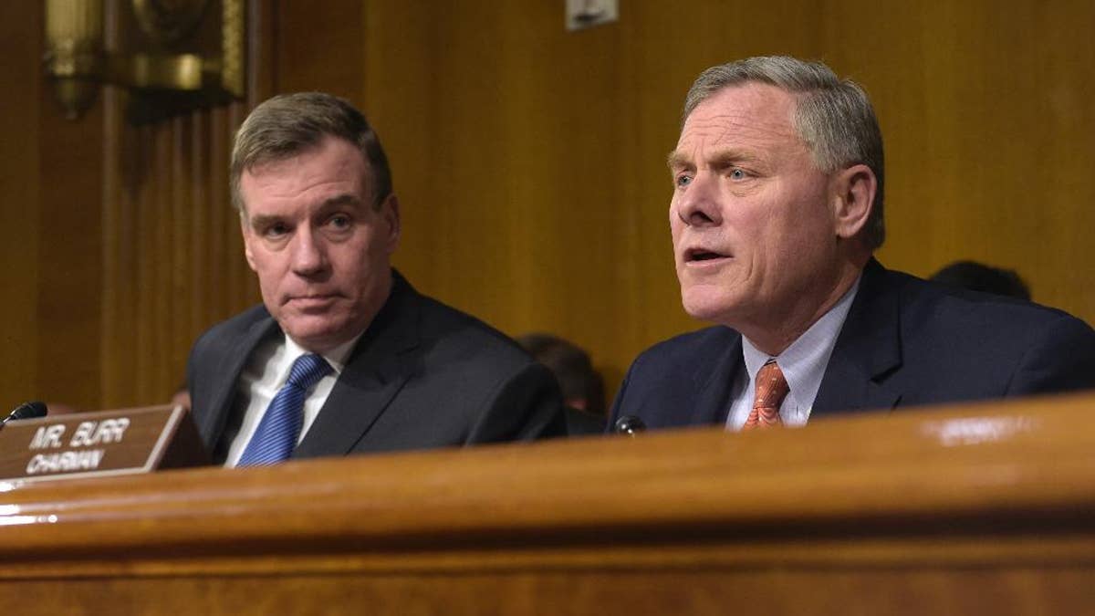 Senate Intelligence Committee Chairman. Sen. Richard Burr, R-N.C., right, joined by Vice Chairman Sen. Mark Warner, D-Va., left, speaks at the Senate Intelligence Committee hearing on Capitol Hill in Washington, Thursday, March 30, 2017. Lawmakers heading the Senate intelligence committee focused squarely on Russia as they opened a hearing Thursday on attempts at undermining the 2016 U.S. presidential election. (AP Photo/Susan Walsh)