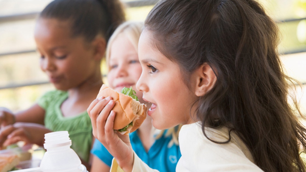 Kindergarten children eating lunch