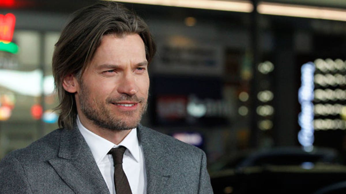 Cast member Nikolaj Coster-Waldau poses at the premiere for the third season of the television series 