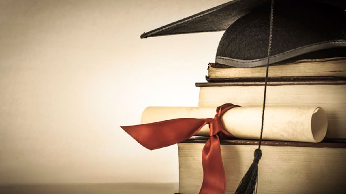 Graduation Scroll and Book Stack