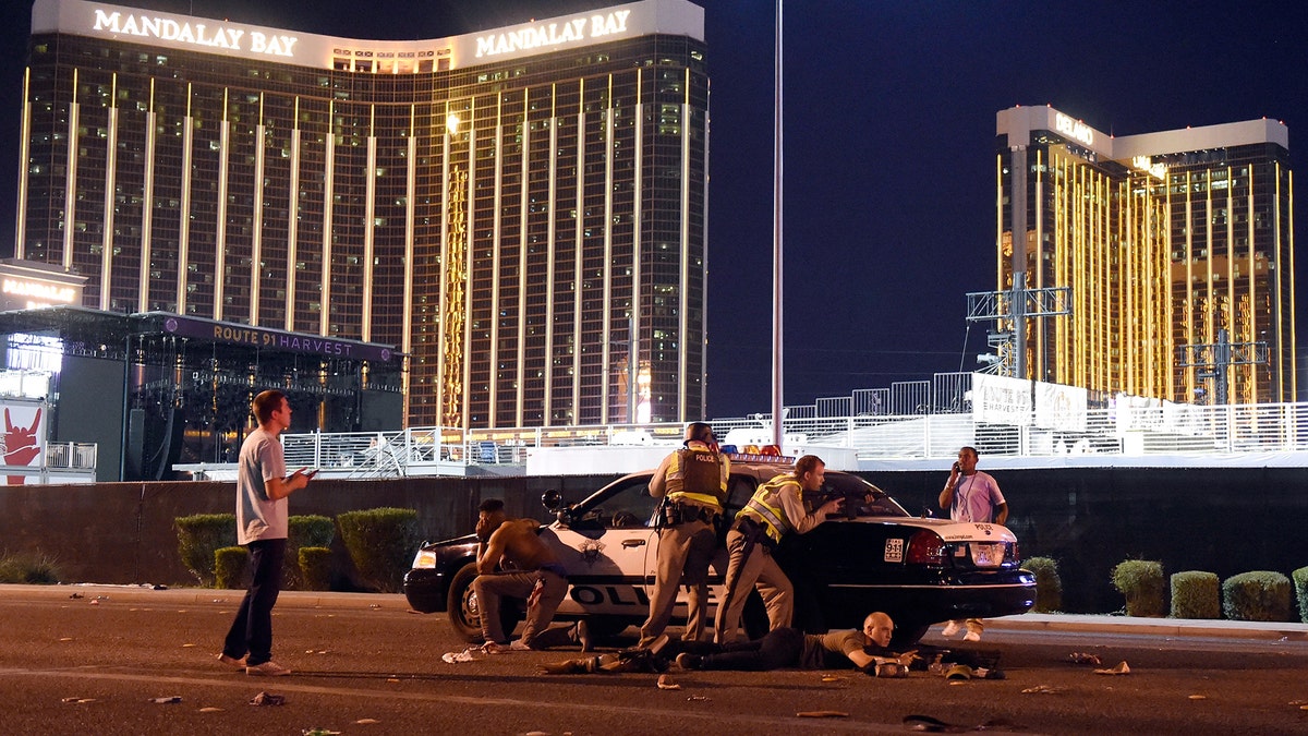 LAS VEGAS, NV - OCTOBER 01:   Las Vegas police stand guard along the streets outside the Route 91 Harvest Country music festival groundss of the Route 91 Harvest on October 1, 2017 in Las Vegas, Nevada.  There are reports of an active shooter around the Mandalay Bay Resort and Casino.  (Photo by David Becker/Getty Images)