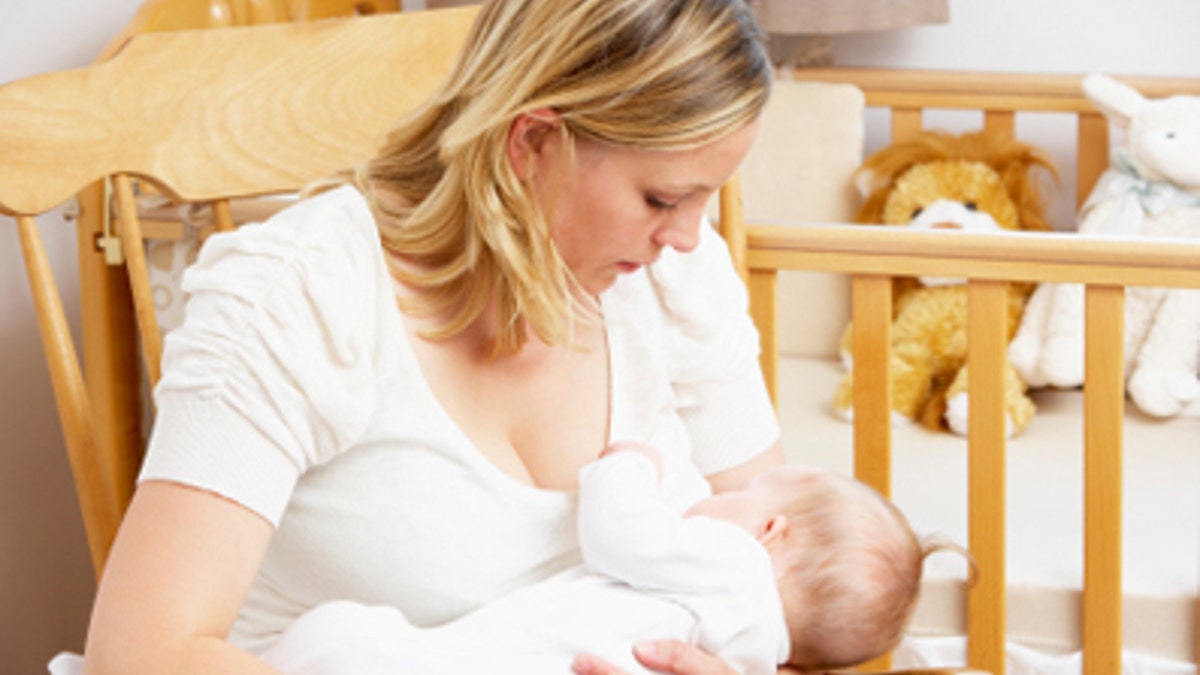 6846d605-Mother Breastfeeding Baby In Nursery