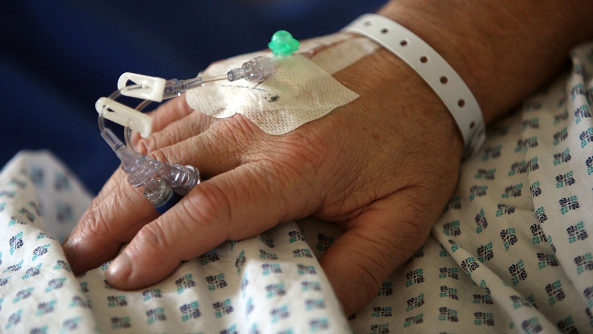 BIRMINGHAM, ENGLAND - MARCH 16:  A nurse tends to recovering patients on a general ward at The Queen Elizabeth Hospital on March 16, 2010 in Birmingham, England.  As the UK gears up for one of the most hotly contested general elections in recent history it is expected that that the economy, immigration, industry, the NHS and education are likely to form the basis of many of the debates.  (Photo by Christopher Furlong/Getty Images)