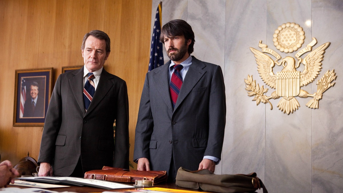 FILE - This undated publicity film image released by Warner Bros. Pictures shows Bryan Cranston, left, as Jack OíDonnell and Ben Affleck as Tony Mendez in 