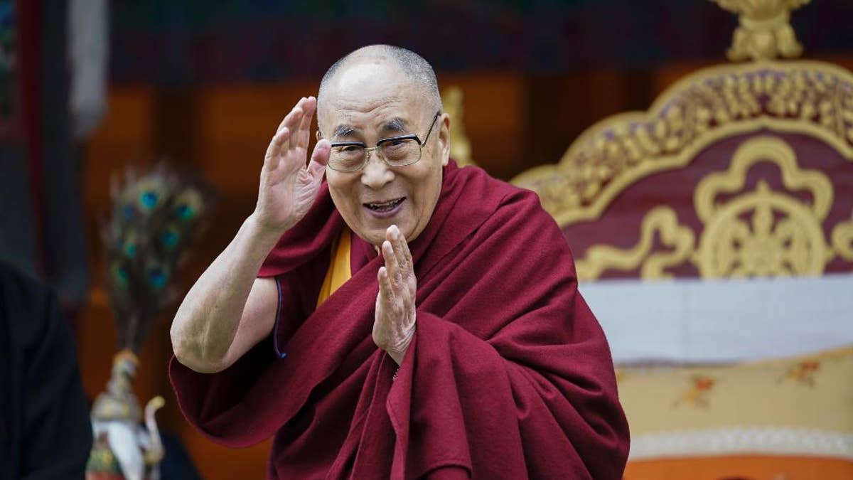 Tibetan spiritual leader the Dalai Lama greets devotees at the Buddha Park in Bomdila, Arunachal Pradesh, India, Wednesday, April 5, 2017. China criticized India on Wednesday for allowing the Dalai Lama to visit the disputed border region, saying it did not consider the matter a purely internal Indian affair and warning it would damage bilateral relations. India said Tuesday that China should not interfere in its domestic issues, as the Dalai Lama began a weeklong visit to Arunachal Pradesh in India's remote northeast. ( AP Photo/ Tenzin Choejor)