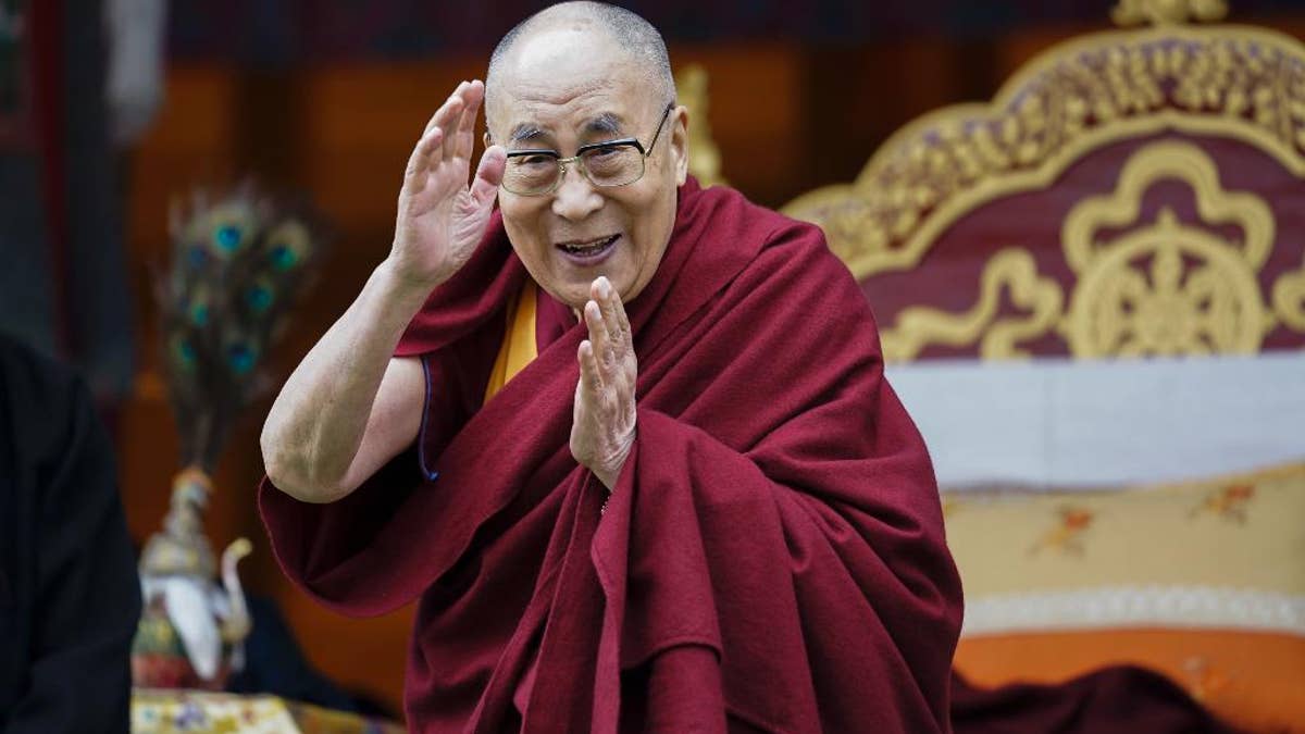 Tibetan spiritual leader the Dalai Lama greets devotees at the Buddha Park in Bomdila, Arunachal Pradesh, India, Wednesday, April 5, 2017. China criticized India on Wednesday for allowing the Dalai Lama to visit the disputed border region, saying it did not consider the matter a purely internal Indian affair and warning it would damage bilateral relations. India said Tuesday that China should not interfere in its domestic issues, as the Dalai Lama began a weeklong visit to Arunachal Pradesh in India's remote northeast. ( AP Photo/ Tenzin Choejor)