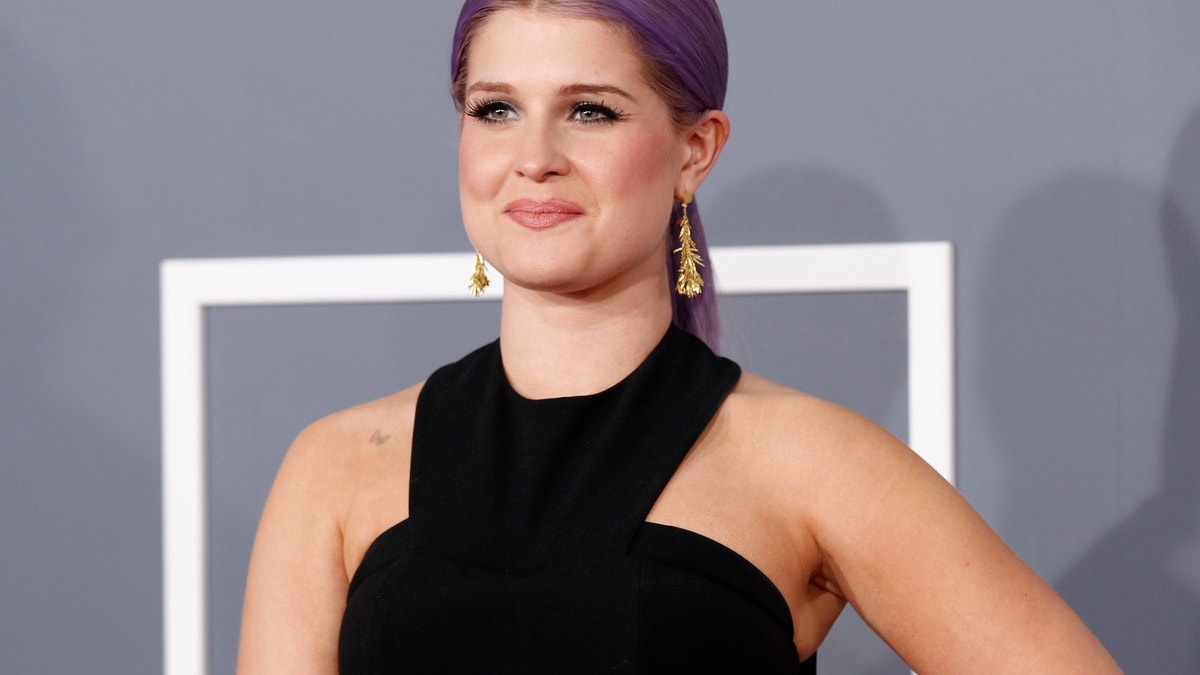 Television personality Kelly Osbourne arrives at the 55th annual Grammy Awards in Los Angeles, California February 10, 2013.