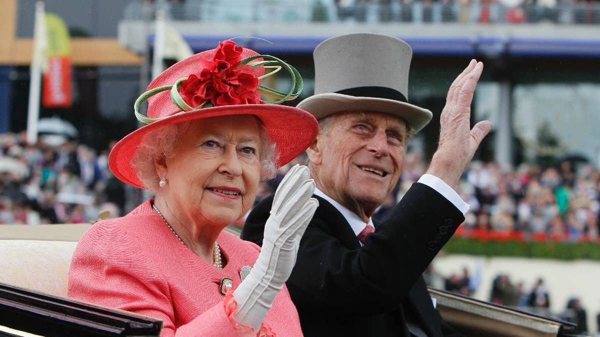 FILE - In this Thursday, June, 16, 2011 file photo Britain's Queen Elizabeth II with Prince Philip arrive by horse drawn carriage in the parade ring on the third day, traditionally known as Ladies Day, of the Royal Ascot horse race meeting at Ascot, England. Queen Elizabeth II's husband, Prince Philip, will stop carrying out public engagements this fall, Buckingham Palace announced Thursday May 4, 2017. (AP Photo/Alastair Grant, File)