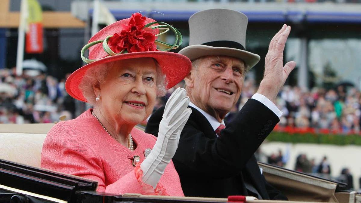 FILE - In this Thursday, June, 16, 2011 file photo Britain's Queen Elizabeth II with Prince Philip arrive by horse drawn carriage in the parade ring on the third day, traditionally known as Ladies Day, of the Royal Ascot horse race meeting at Ascot, England. Queen Elizabeth II's husband, Prince Philip, will stop carrying out public engagements this fall, Buckingham Palace announced Thursday May 4, 2017. (AP Photo/Alastair Grant, File)