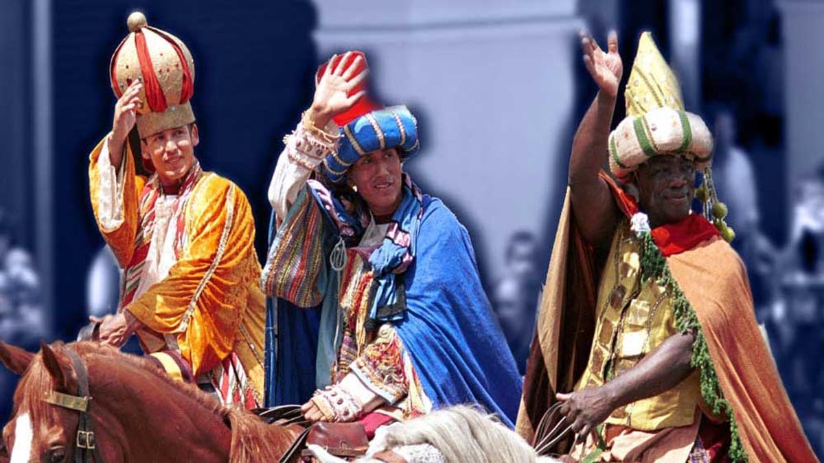 Reenactors wave during the celebration of Three Kings Day on Jan. 6, or the Epiphany, which marks the day when Catholics believe the Three Wise Men delivered gifts of frankincense, myrrh and gold to the baby Jesus.