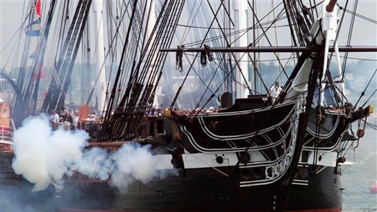 The USS Constitution fires its cannons off Castle Island in Boston on its annual 4th of July turn around in Boston Harbor, Monday, July 4, 2011. (AP Photo/Michael Dwyer)
