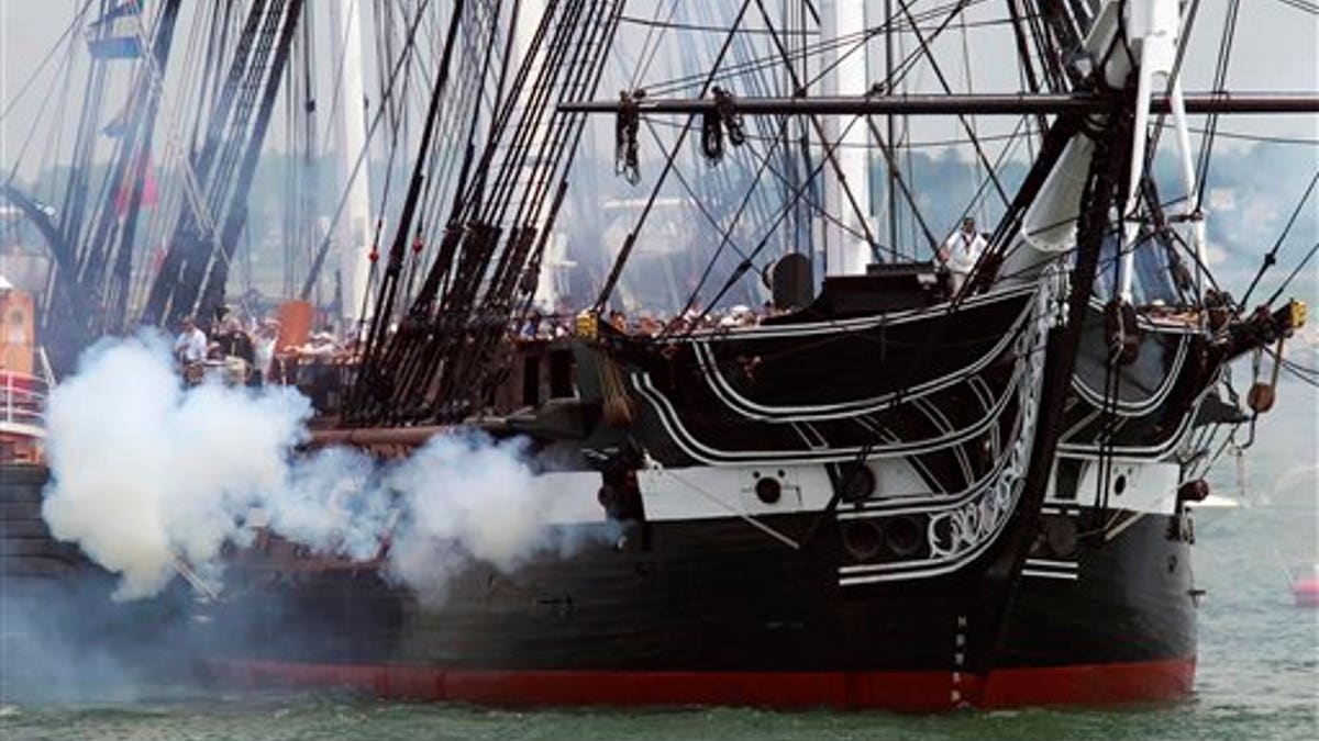 The USS Constitution fires its cannons off Castle Island in Boston on its annual 4th of July turn around in Boston Harbor, Monday, July 4, 2011. (AP Photo/Michael Dwyer)