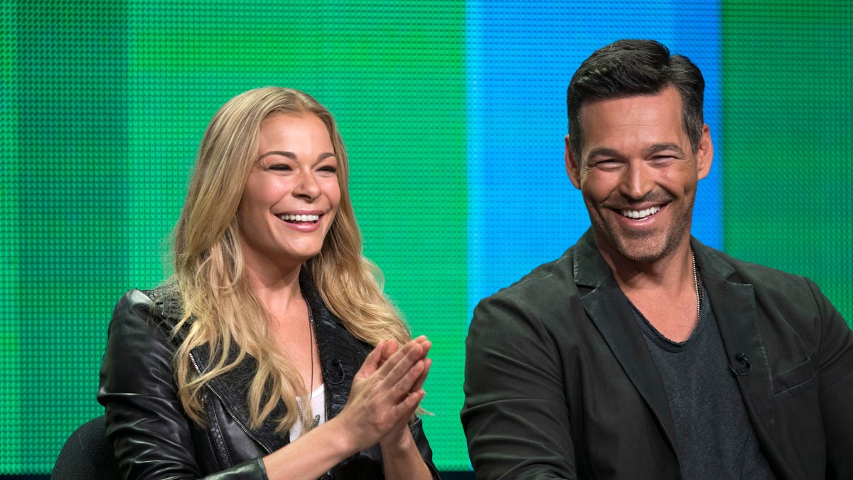 LeAnn Rimes and her husband Eddie Cibrian attend a panel for the VH1 television series "LeAnn & Eddie" during the Television Critics Association Cable Summer Press Tour in Beverly Hills, California July 11, 2014. REUTERS/Mario Anzuoni (UNITED STATES - Tags: ENTERTAINMENT) - RTR3Y85U