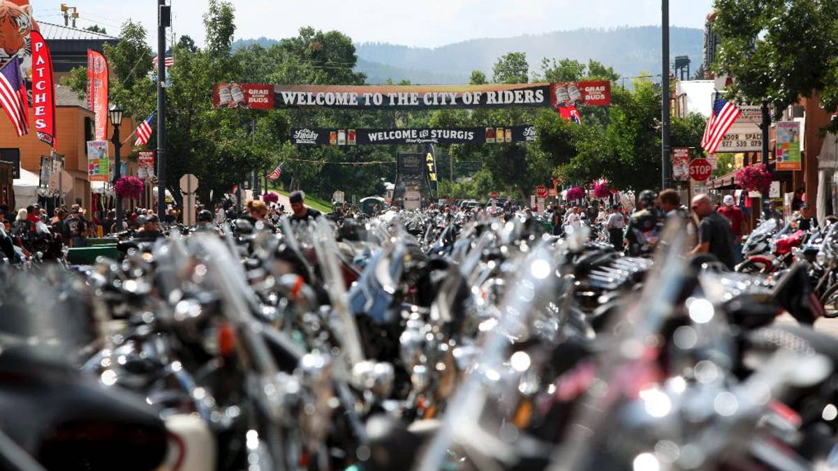 FILE - In this Aug. 1, 2014 file photo, the city streets of Sturgis are lined with motorcycles days before the official kickoff of the annual Sturgis Motorcycle Rally in Sturgis, S.D. Preparations are under way for the landmark 75th anniversary rally beginning Monday, Aug. 3, 2015, where organizers are planning for up to one million people. (AP Photo/Toby Brusseau, File)