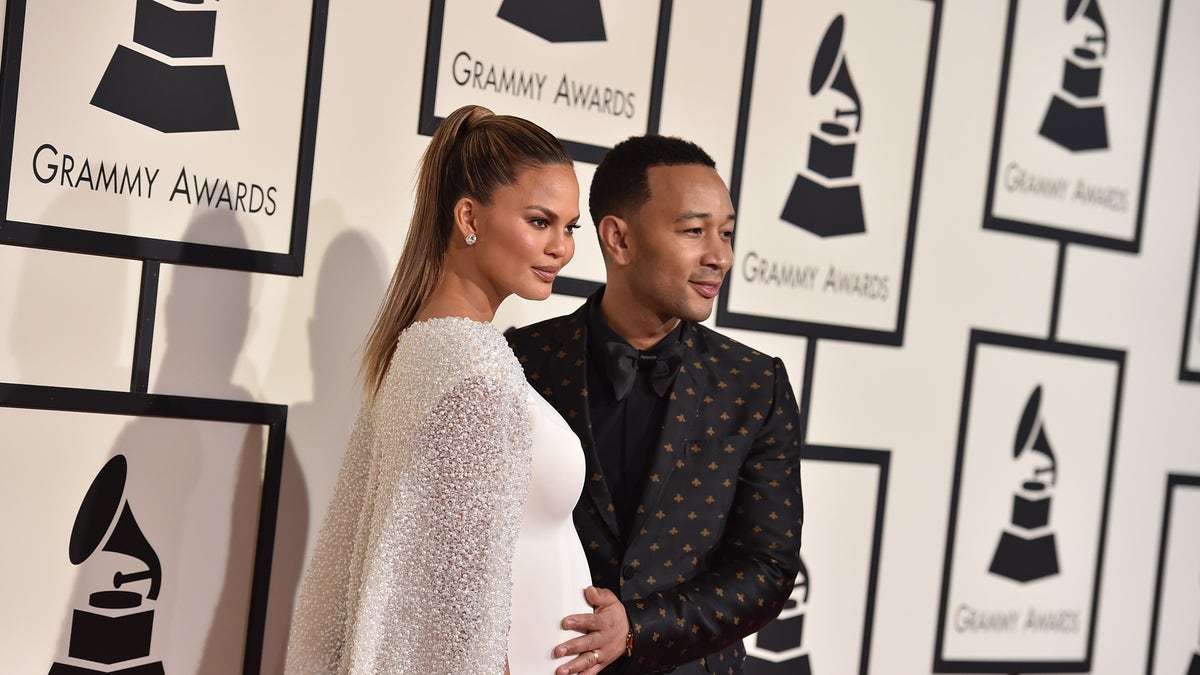 Chrissy Teigen, left, and John Legend arrive at the 58th annual Grammy Awards at the Staples Center on Monday, Feb. 15, 2016, in Los Angeles. (Photo by Jordan Strauss/Invision/AP)