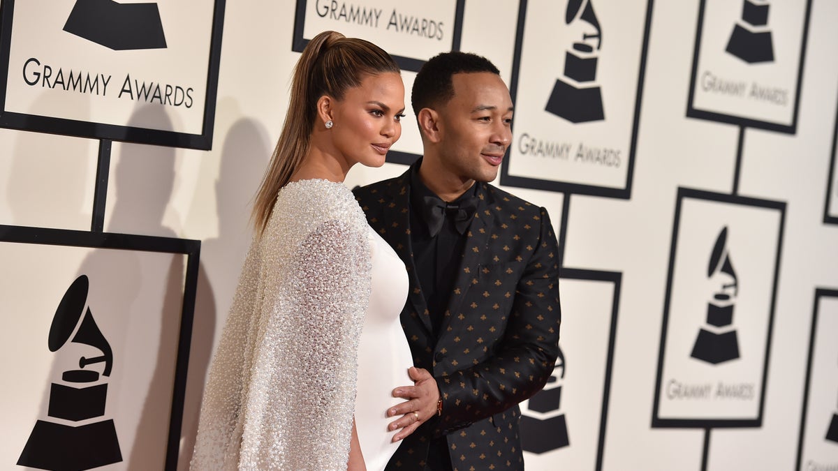 Chrissy Teigen, left, and John Legend arrive at the 58th annual Grammy Awards at the Staples Center on Monday, Feb. 15, 2016, in Los Angeles. (Photo by Jordan Strauss/Invision/AP)