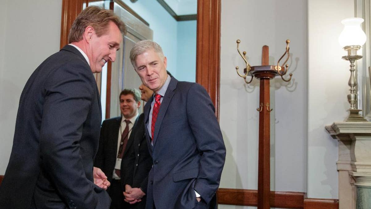 Supreme Court Justice nominee Neil Gorsuch meets with Senate Judiciary Committee member Sen. Jeff Flake, R-Ariz., Wednesday, Feb. 8, 2017, on Capitol Hill in Washington. (AP Photo/J. Scott Applewhite)