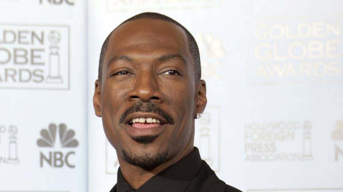 Eddie Murphy accepts the Golden Globe for best supporting actor for his work in "Dreamgirls" at the 64th Annual Golden Globe Awards on Monday, Jan. 15, 2007, in Beverly Hills, Calif. (AP Photo/Kevork Djansezian)