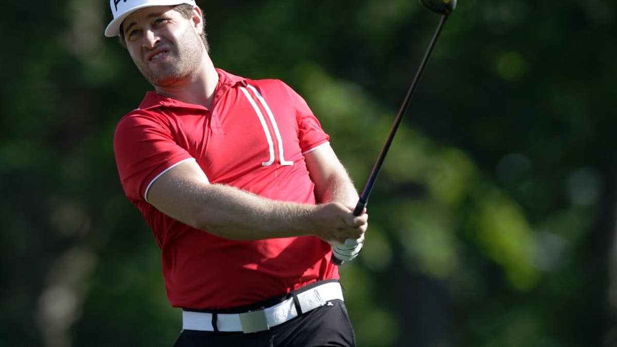 David Lingmerth, of Sweden, watches his approach shot on the ninth hole during the second round of the Memorial golf tournament, Friday, June 5, 2015, in Dublin, Ohio. (AP Photo/Jay LaPrete)