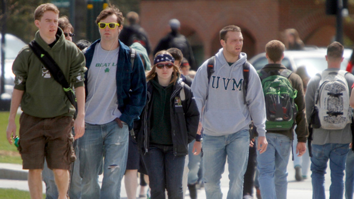 Students walk across campus at the University of Vermont on Monday, April 30, 2012 in Burlington, Vt.