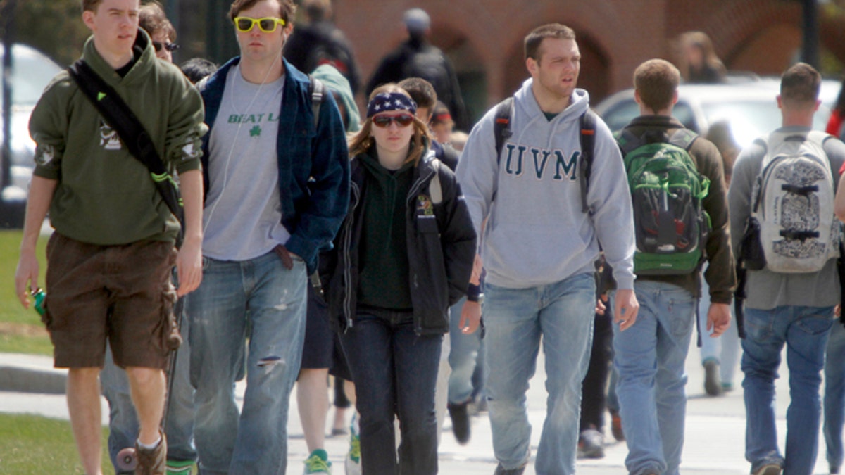 Students walk across campus at the University of Vermont on Monday, April 30, 2012 in Burlington, Vt.