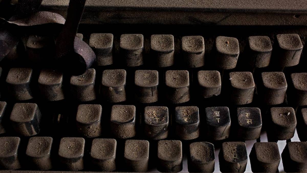 In this Jan. 16, 2017 photo, an old Remington 2000 typewriter lies covered in dust in New Delhi, India. In India, the typewriter was never just a piece of office equipment. It was a sign of education, of professional achievement, of women’s growing independence as they slowly entered the workforce. But in one of the last places in the world where it remains a part of everyday life, twilight is at hand. (AP Photo/Bernat Armangue)