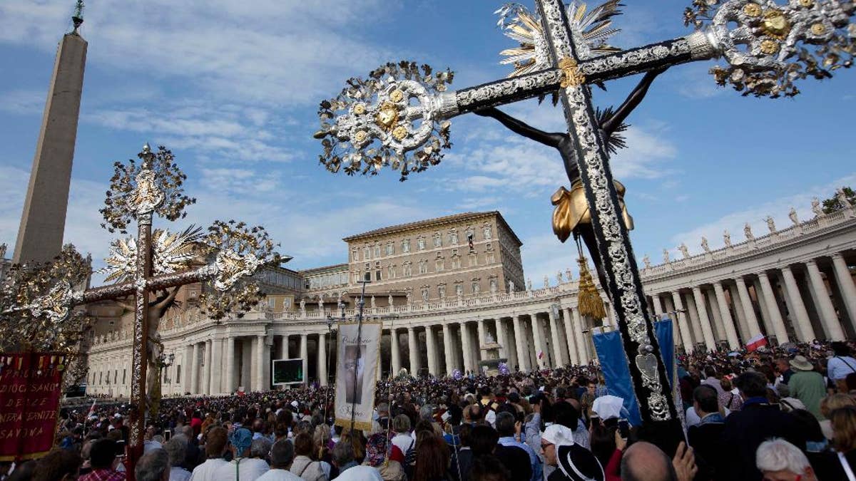Photo shows crucifix in center view at St. Peter's Square at the Vatican