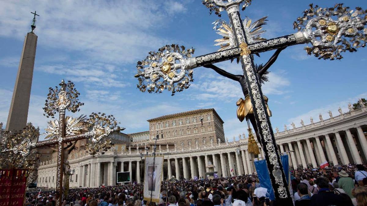 Photo shows crucifix in center view at St. Peter's Square at the Vatican