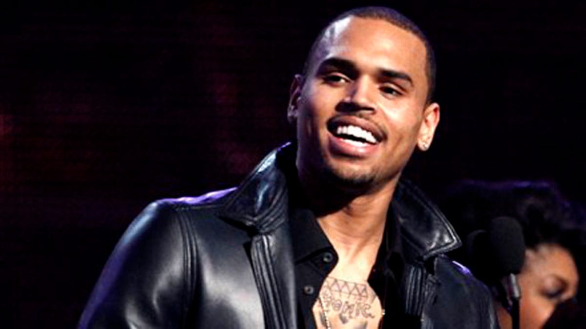 FILE - In this Feb. 12, 2012 file photo, Chris Brown accepts the award for best R&B album for "F.A.M.E." during the 54th annual Grammy Awards in Los Angeles. A Los Angeles judge on Tuesday July 10, 2012 ordered an audit of Browns community service hours after a prosecutor said there appeared to be discrepancies in the records about how many hours and days he has performed. Brown was ordered to appear at the next hearing, scheduled for Aug. 21, 2012. (AP Photo/Matt Sayles, File)