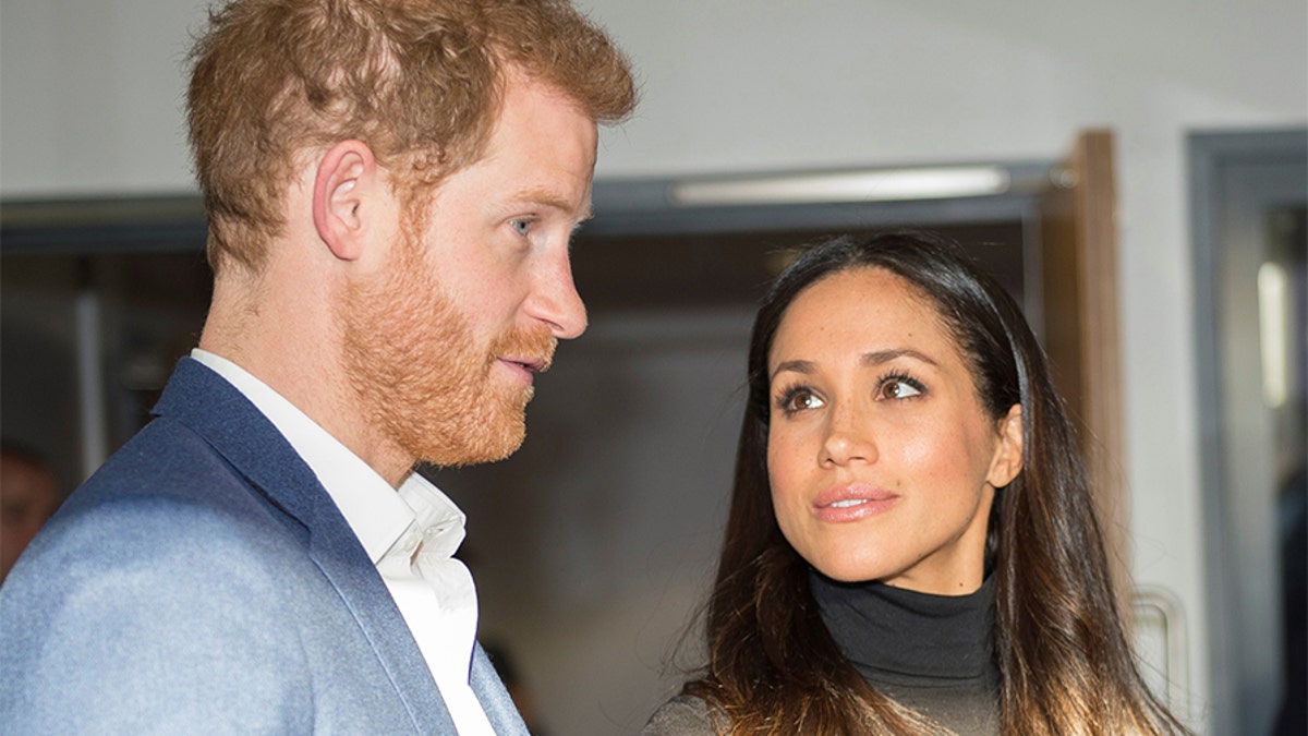 Britain's Prince Harry and his fiancee Meghan Markle visit the Nottingham Academy school in Nottingham, Britain, December 1, 2017. REUTERS/Andy Stenning/Pool - RC1A58AC09F0