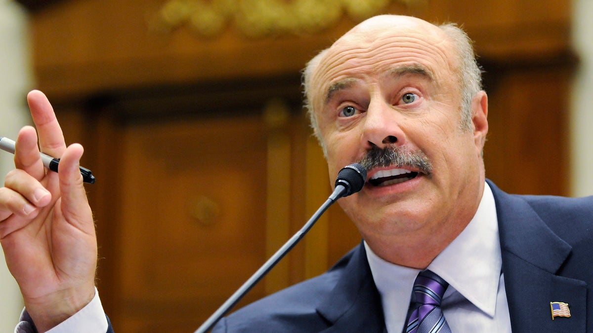 Dr. Phil McGraw, television personality and psychologist, talks about cyber-bullying during a hearing of the Healthy Families and Communities Subcommittee of the U.S. House Committee on Education and Labor, on Capitol Hill in Washington, June 24, 2010. REUTERS/Jonathan Ernst (UNITED STATES - Tags: ENTERTAINMENT POLITICS) - RTR2FOBM