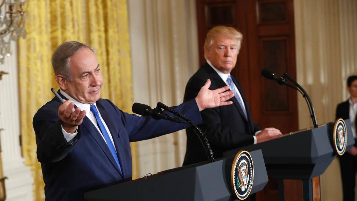 FILE - In this Wednesday, Feb. 15, 2017 file photo, President Donald Trump and Israeli Prime Minister Benjamin Netanyahu give a joint news conference in the East Room of the White House in Washington. The debate among American Jews over President Donald Trump has become as raucous as the first weeks of the Trump administration itself, hardening divisions between liberal and conservative Jews that have been growing for years. (AP Photo/Pablo Martinez Monsivais)