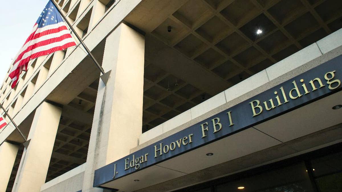 FILE - In this Nov. 2, 2016, file photo, the FBI's J. Edgar Hoover headquarter building in Washington. The FBI has been reviewing the handling of thousands of terror-related tips and leads received over the last three years to make sure they were properly investigated and that no obvious red flags were missed, The Associated Press has learned. (AP Photo/Cliff Owen, File)