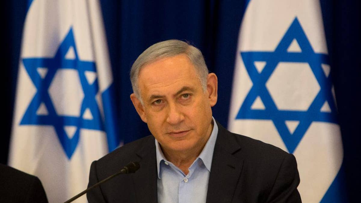 Israeli Prime Minister Benjamin Netanyahu chairs the weekly cabinet meeting in the Israeli controlled Golan Heights, Sunday, April 17, 2016. Israeli Prime Minister Benjamin Netanyahu said Sunday his country will never withdraw from the war won Golan Heights and the strategic plateau bordering Syria will forever stay in Israeli hands. (AP Photo/Sebastian Scheiner, Pool)